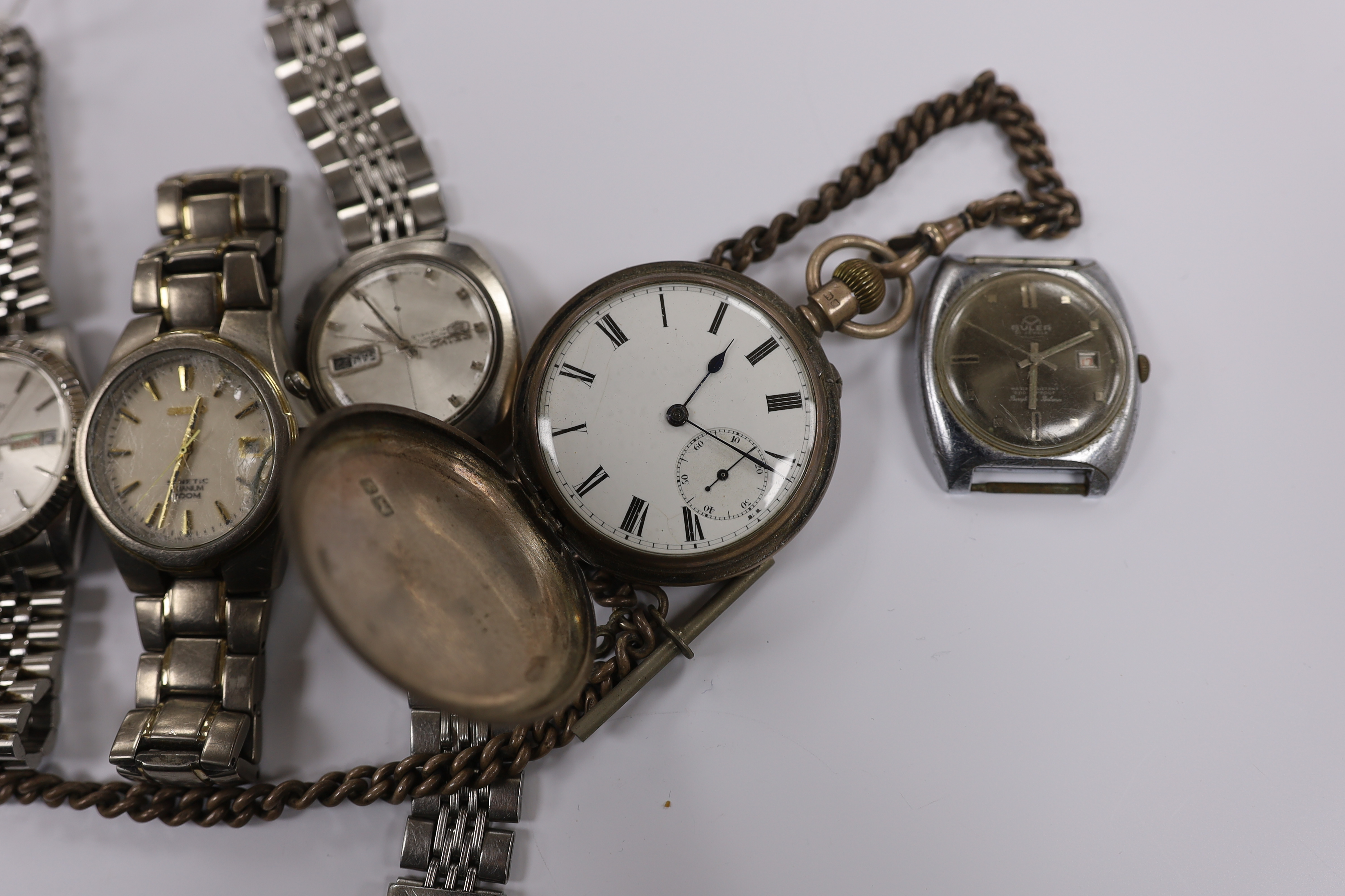 Two gentleman's modern stainless steel Seiko wrist watches, three others including a Rotary and two pocket watches including silver with silver albert.